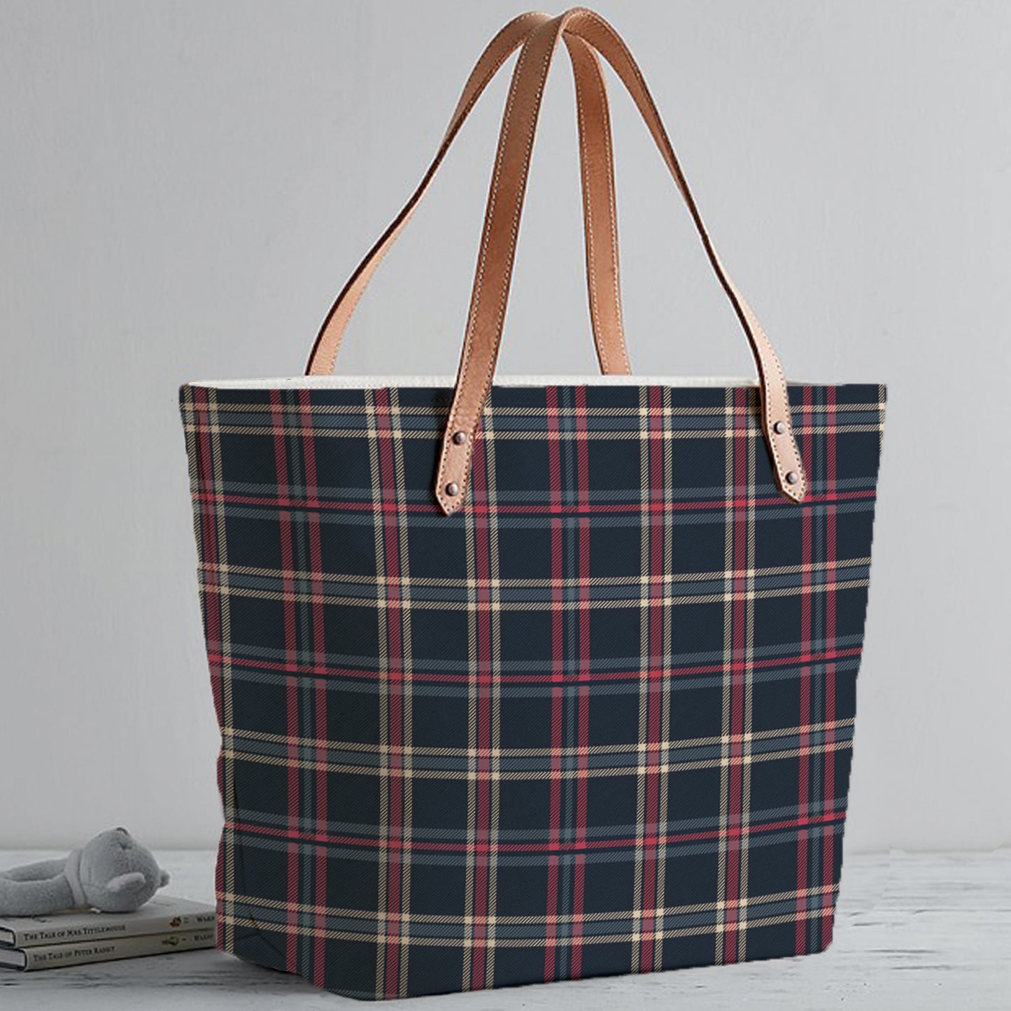 Stylish navy blue and red plaid tote bag, perfect for carrying essentials in style.