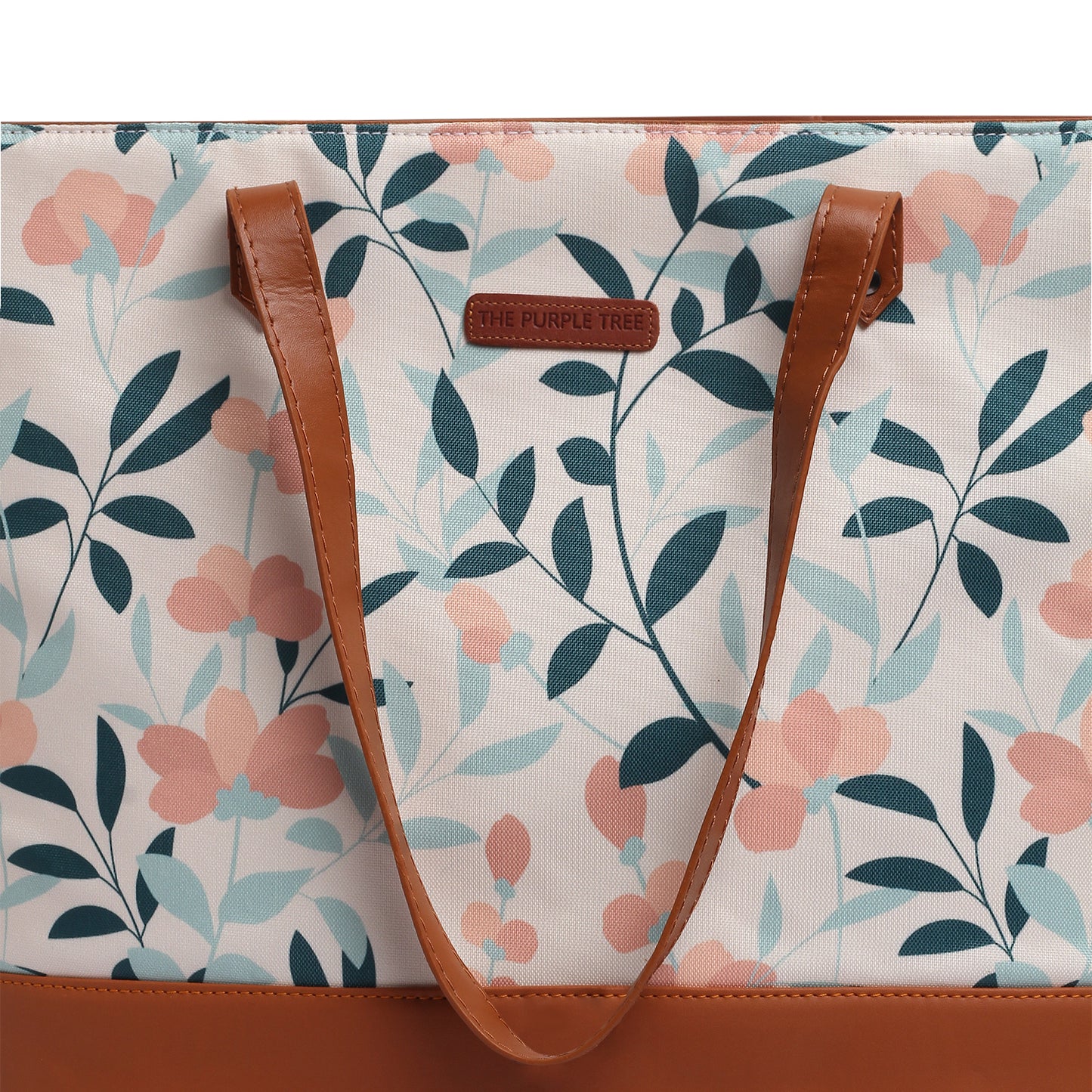 A stylish tote bag with a floral pattern and a brown leather handle. Perfect for adding a touch of elegance to any outfit.