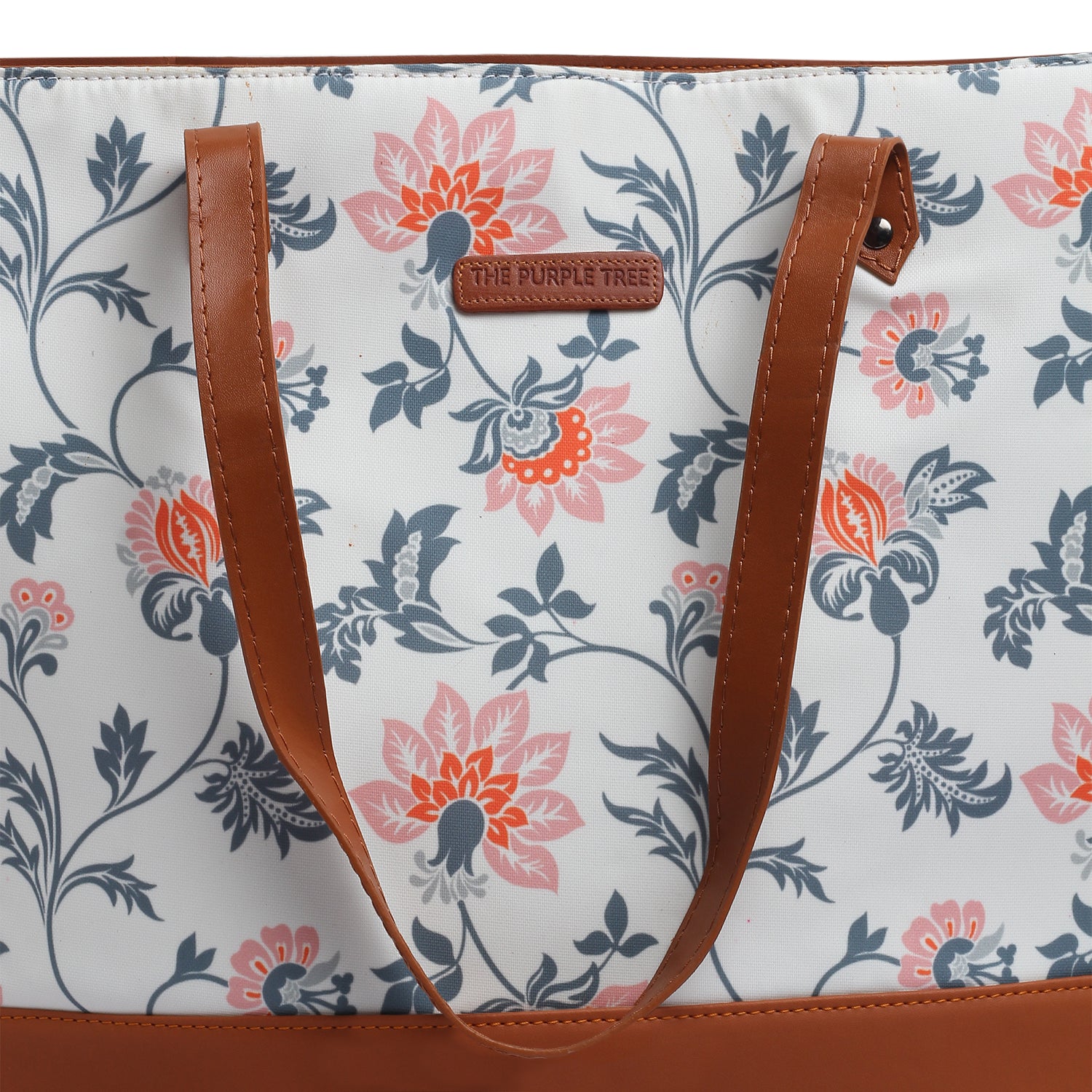 4. Lovely floral tote bag sitting on a chair.