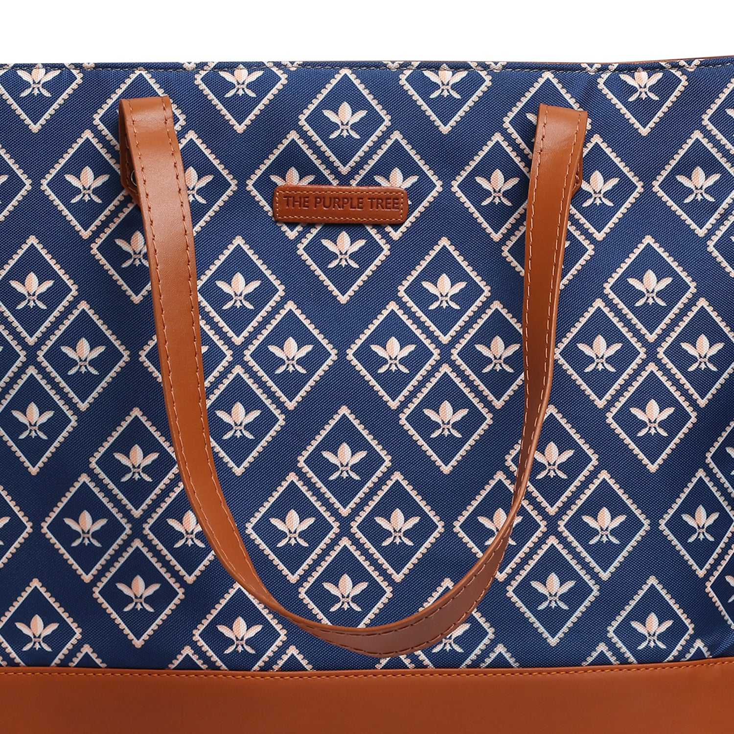 Blue and brown tote bag placed beside a wooden chair