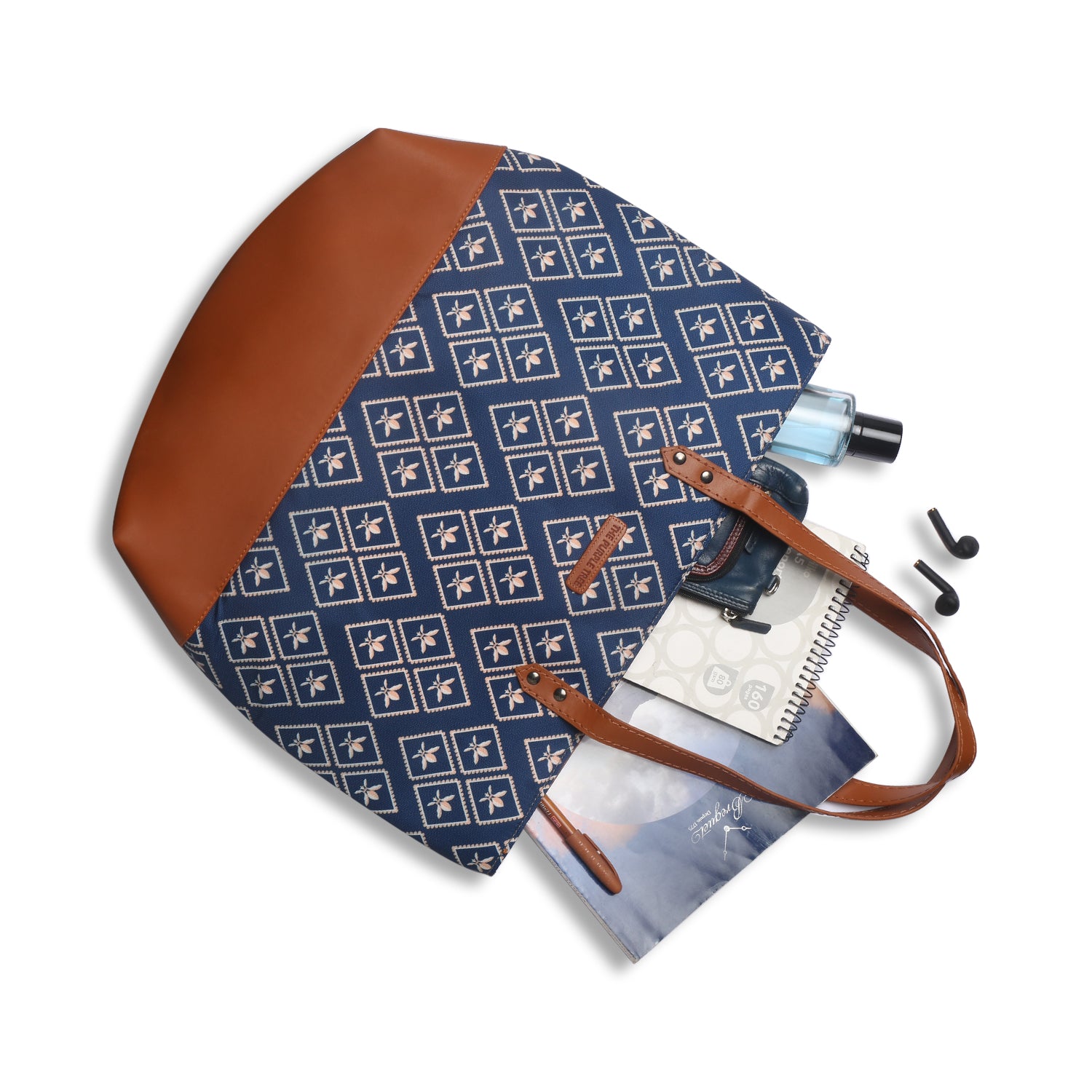 Blue and brown tote bag resting on wooden chair