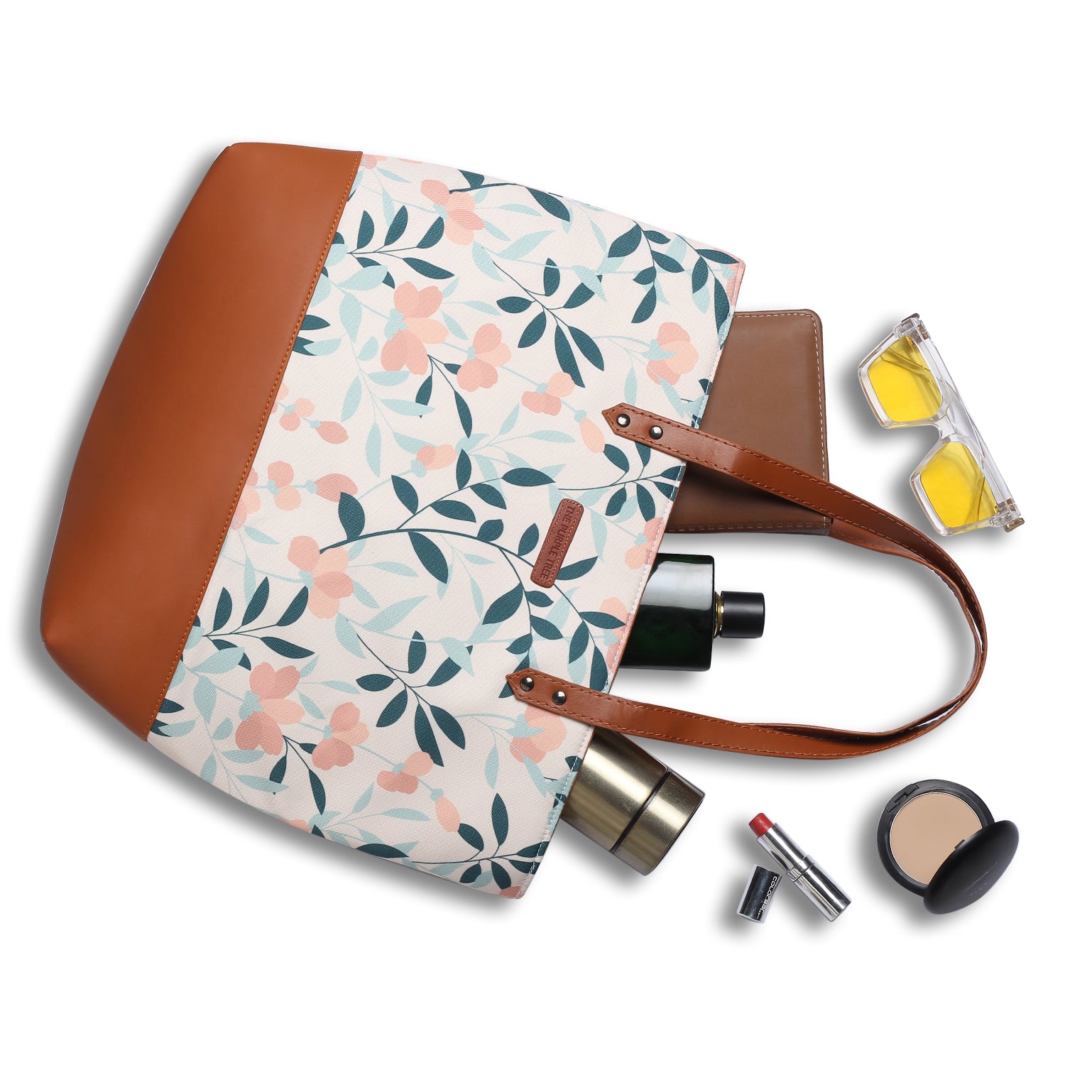 Trendy tote with floral design and brown leather strap
