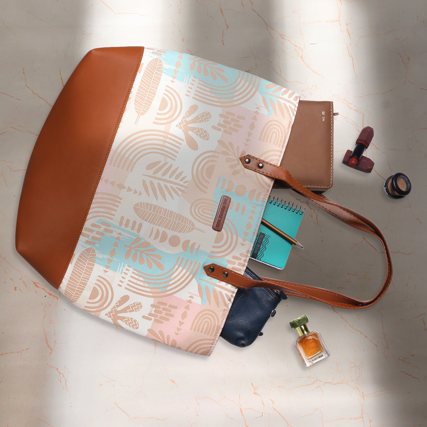 Trendy tote bag showcasing a beautiful light blue and pink pattern, a versatile piece.