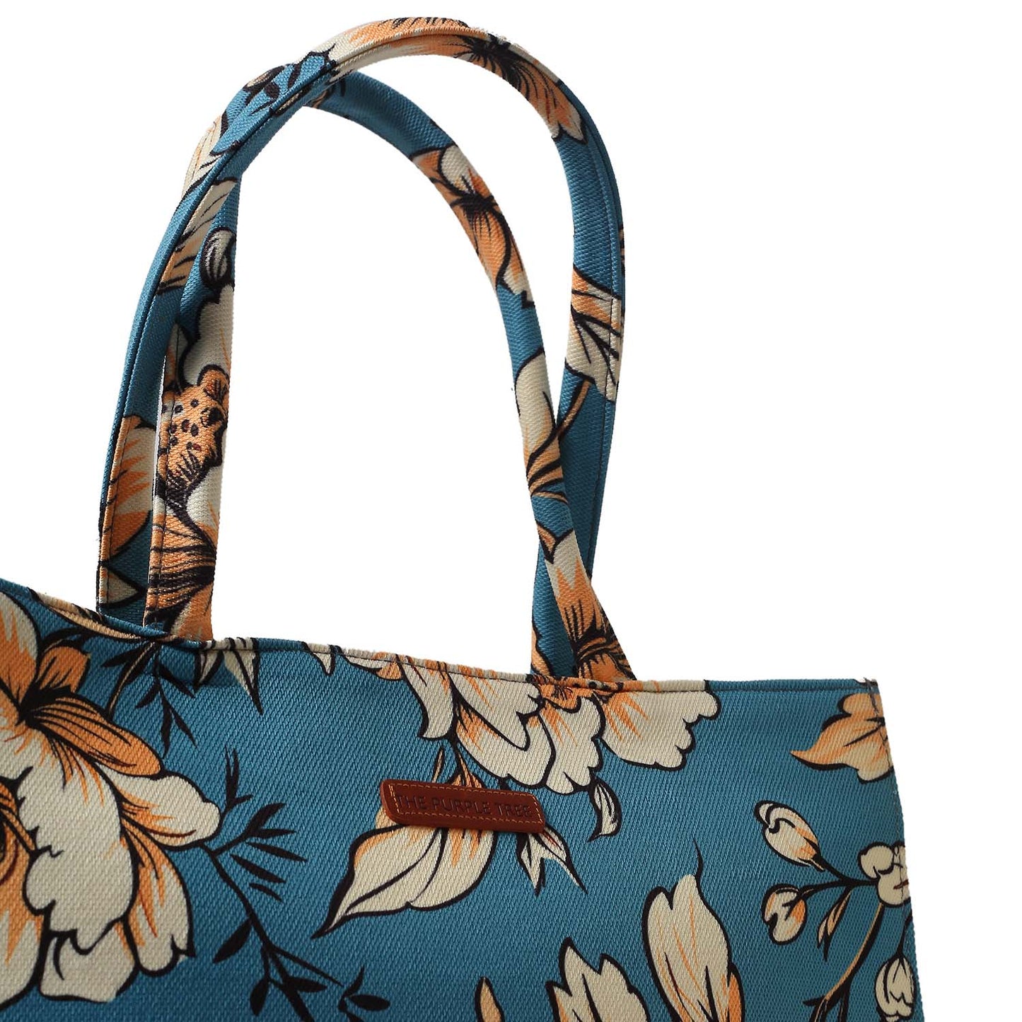 A stylish tote bag with a blue handle, adorned with a beautiful floral print. Perfect for adding a touch of elegance to any outfit.