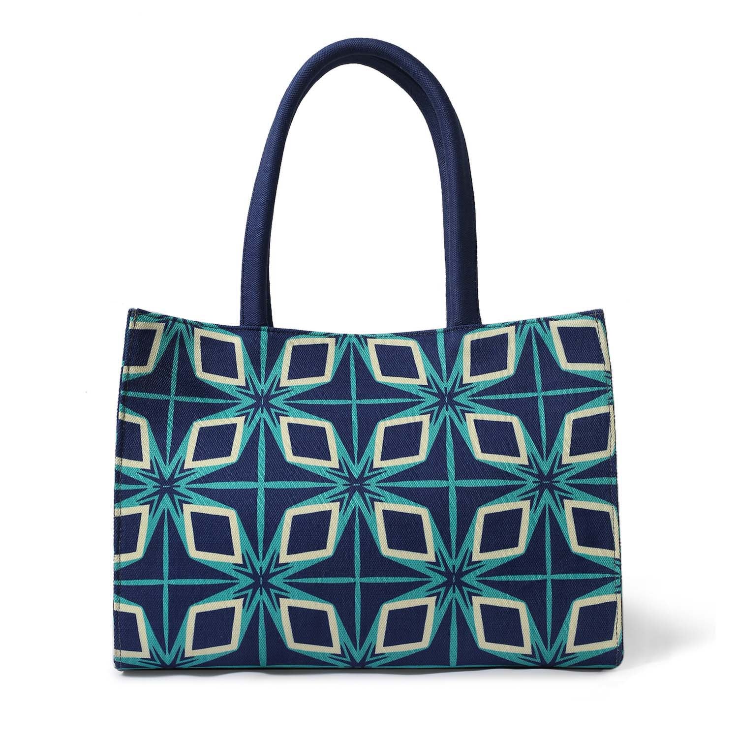 Fashionable tote bag featuring blue and green design with book and sunglasses.
