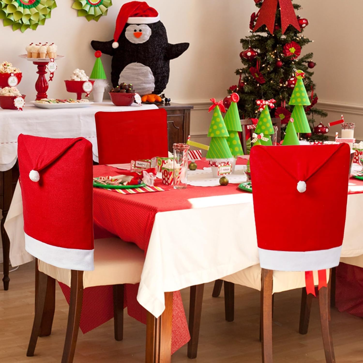 Two Santa Claus hats placed on chairs, ready for the holiday season.