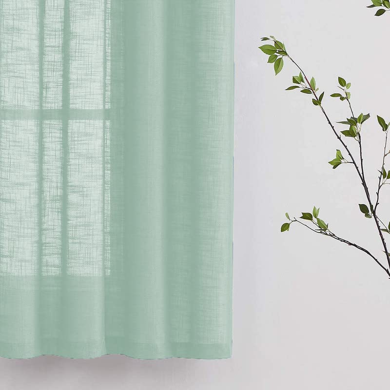 Plain green linen cloth background.