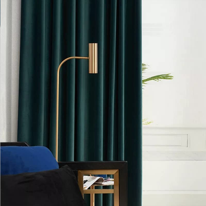 Image of a dark green curtain beside a white vase.