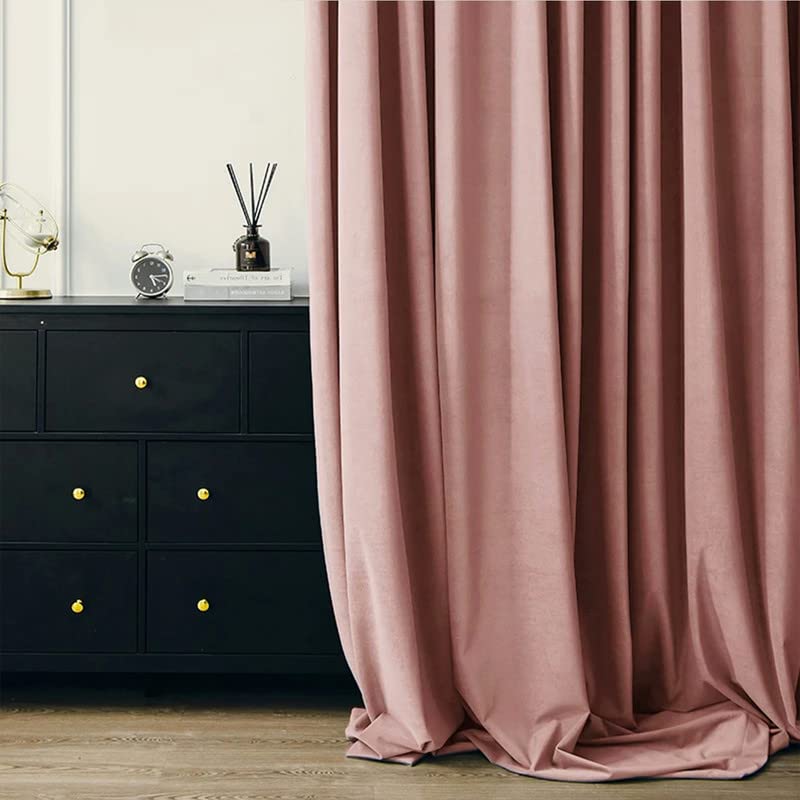Close-up of a pink curtain featuring a stylish bow detail.