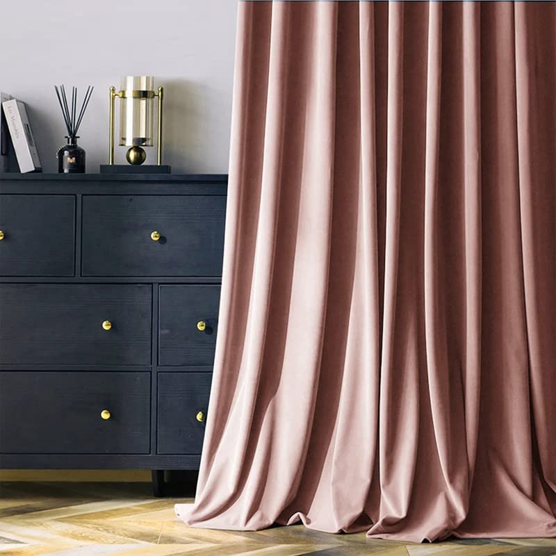 A close-up of a pink curtain adorned with a bow, adding a touch of elegance and charm to the room.