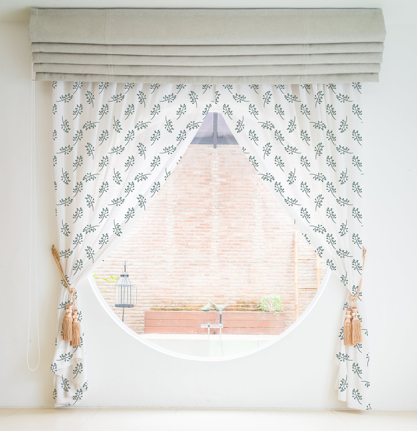 Stylish curtain adorned with a green leaf pattern for a natural feel.