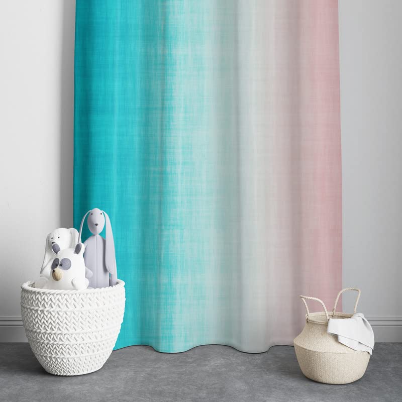 A vibrant pink and blue curtain hanging against a clean white wall.