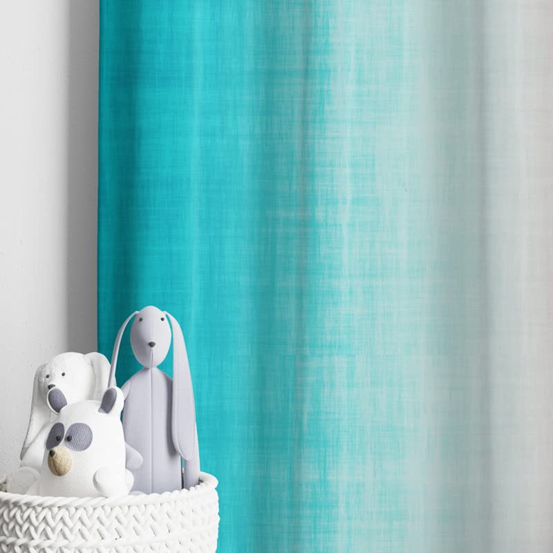  Colorful curtain in pink and blue against a white wall.