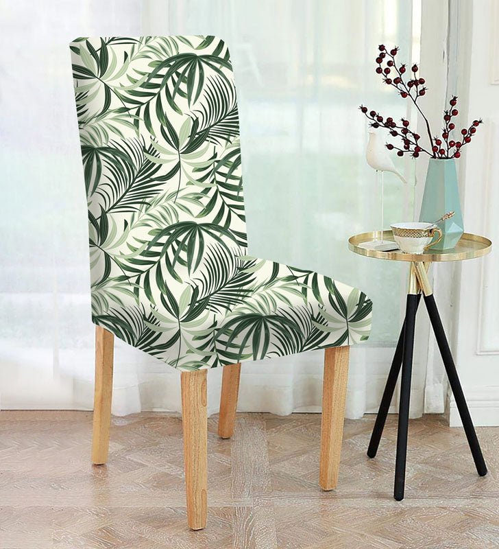 A stylish chair with a palm leaf print in green and white. Perfect for adding a tropical touch to any room!