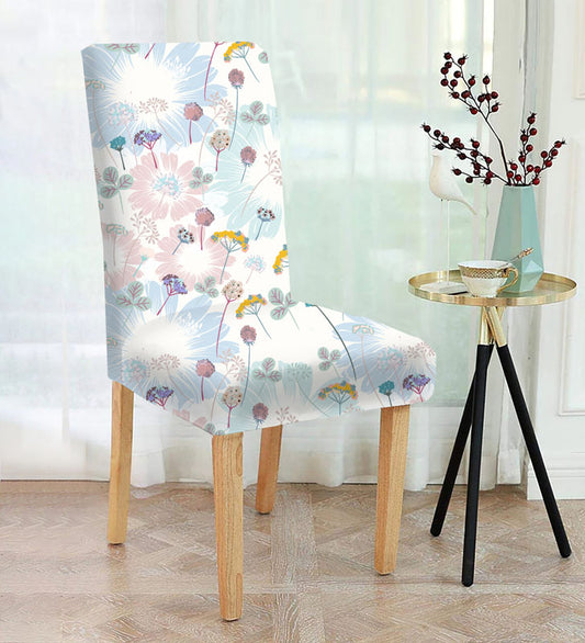 A chair with a floral pattern and a vase on the side, adding a touch of elegance to the room.