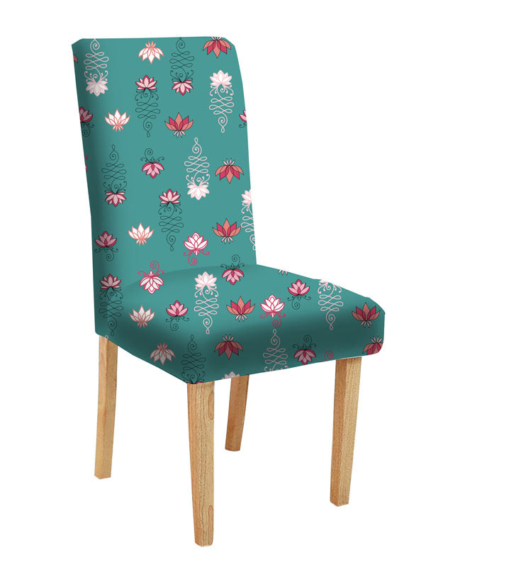 Chair with floral design and vase next to it.