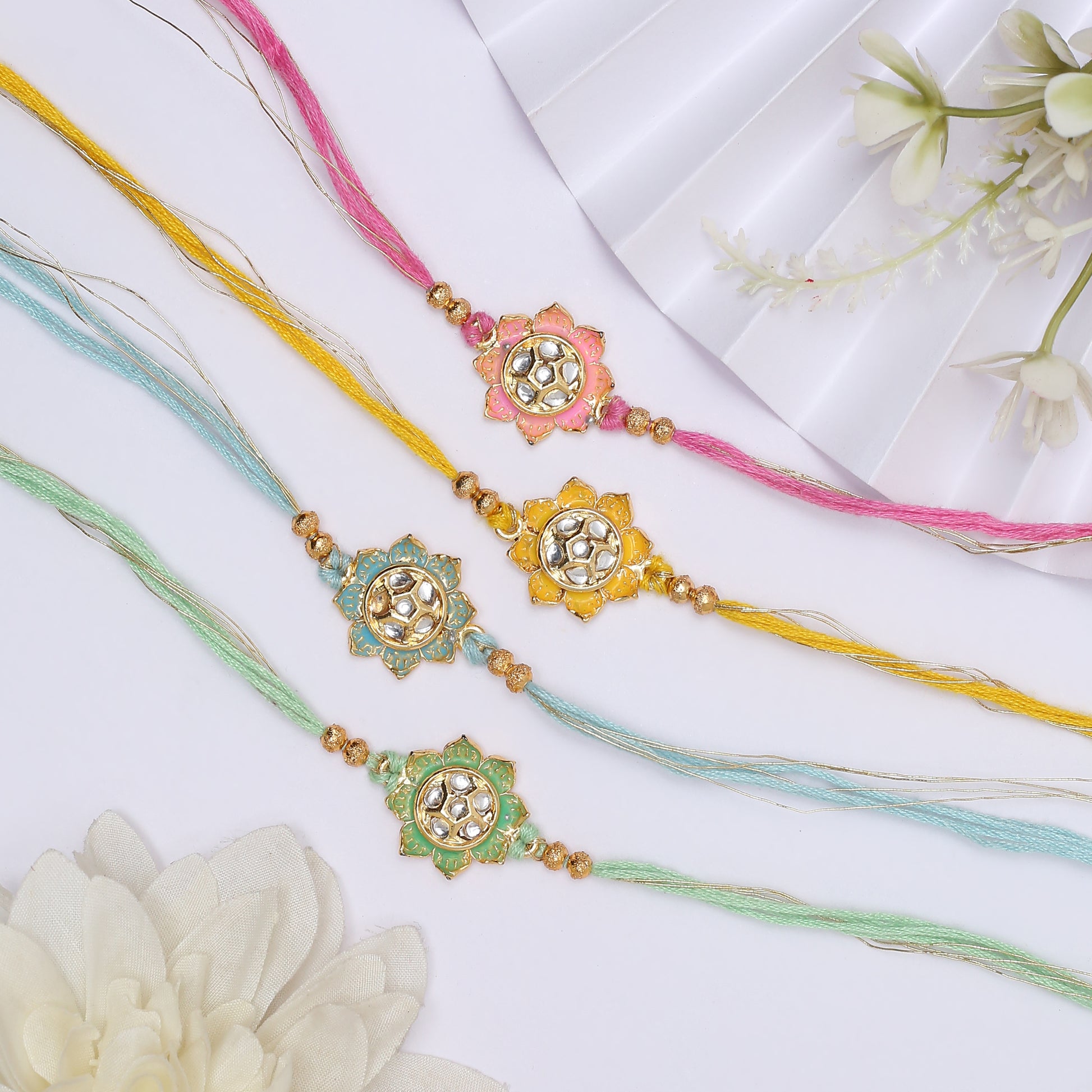 Colorful rakhi set with flower design, perfect for celebrating Raksha Bandhan.