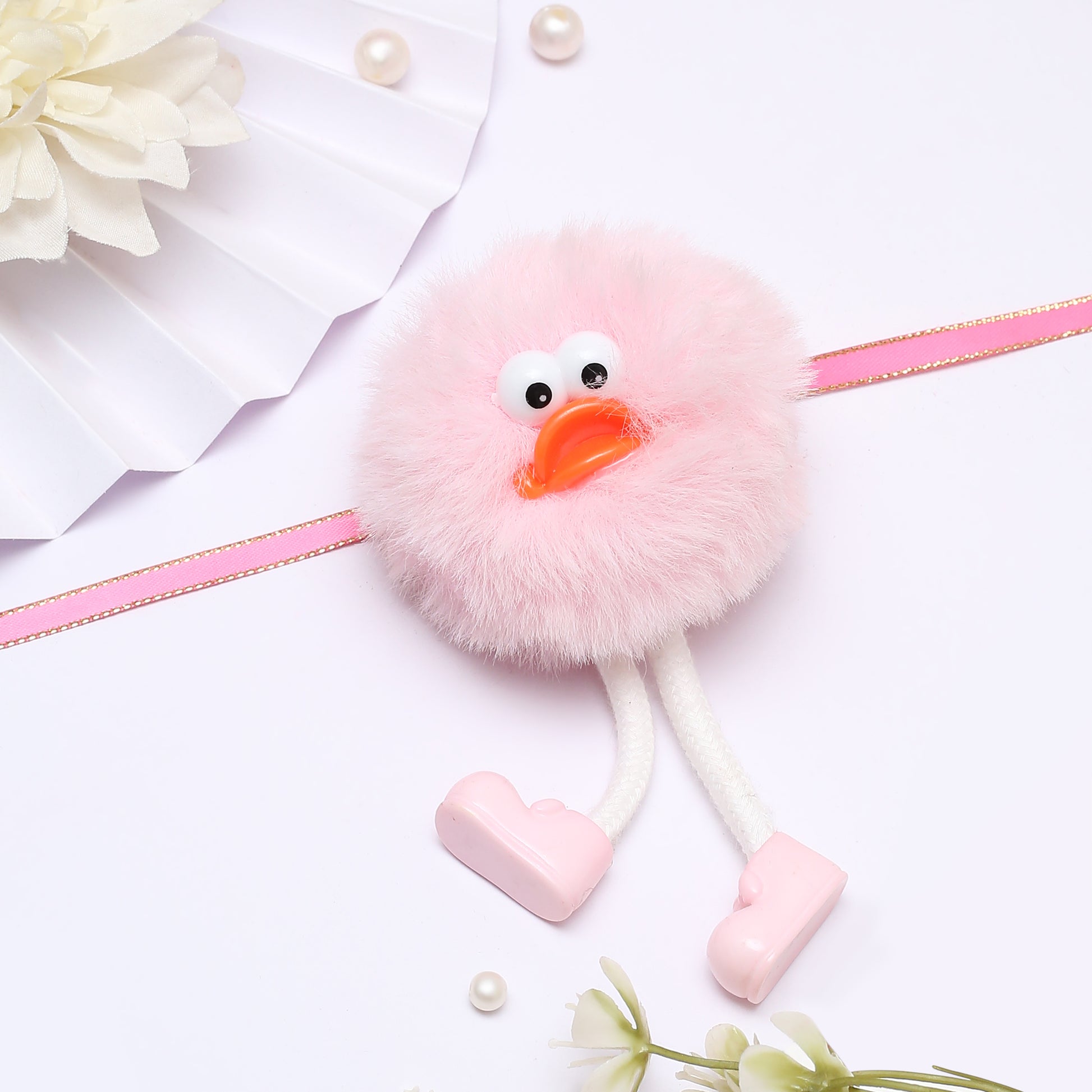 A Cute Pink Fluffy Rakhi.