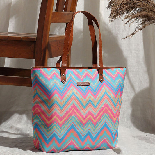 A vibrant tote bag with a zigzag pattern, adding a pop of color to your style!