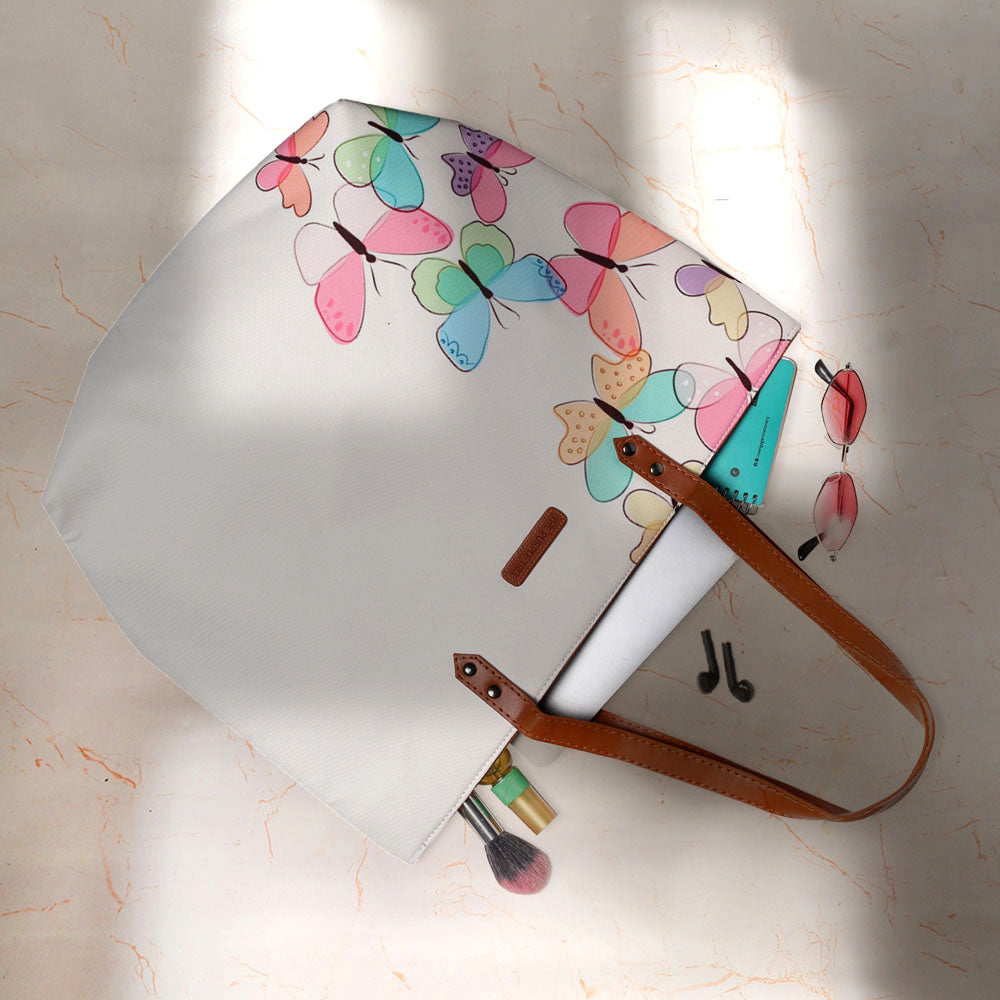 Large tote bag featuring colorful butterflies, a stylish accessory for any outfit.
