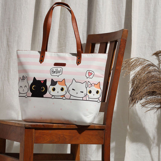 A tote bag featuring a charming cat design, perfect for cat lovers and adding a touch of feline flair to your style.