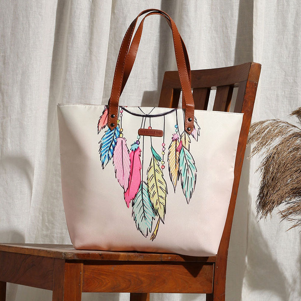 Colorful dream catcher design on tote bag.