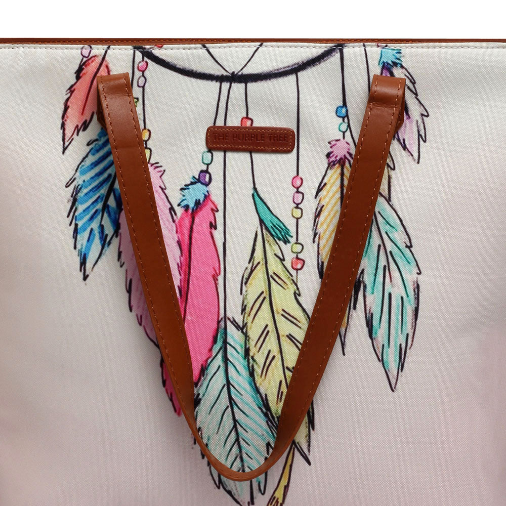 A vibrant dream catcher design on a tote bag. Perfect for adding a pop of color to your outfit!