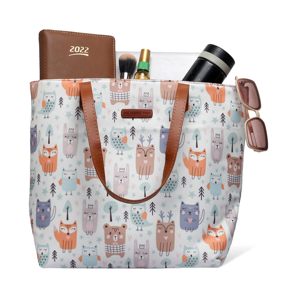 A charming white tote bag featuring a cute animal pattern, ideal for animal enthusiasts.