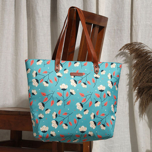  Blue and white floral print tote bag, perfect for carrying essentials in style.