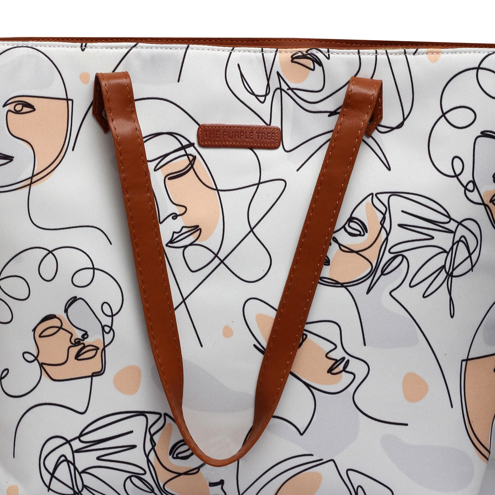 Trendy white tote bag adorned with a fashionable design of women's faces, a must-have.