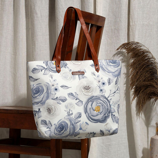 White and blue floral print tote bag, perfect for carrying essentials in style.