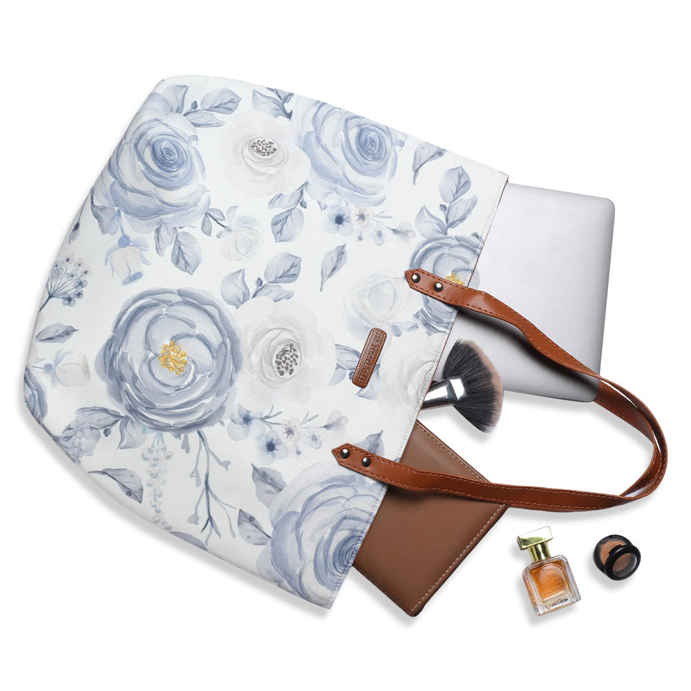 Chic white and blue floral print tote bag, a fashionable accessory for any outfit.