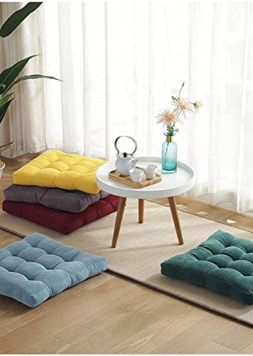 Colorful cushions stacked on a plush carpet.