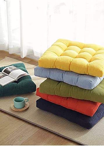  Brightly colored cushions placed on the floor, creating a lively and cozy atmosphere.