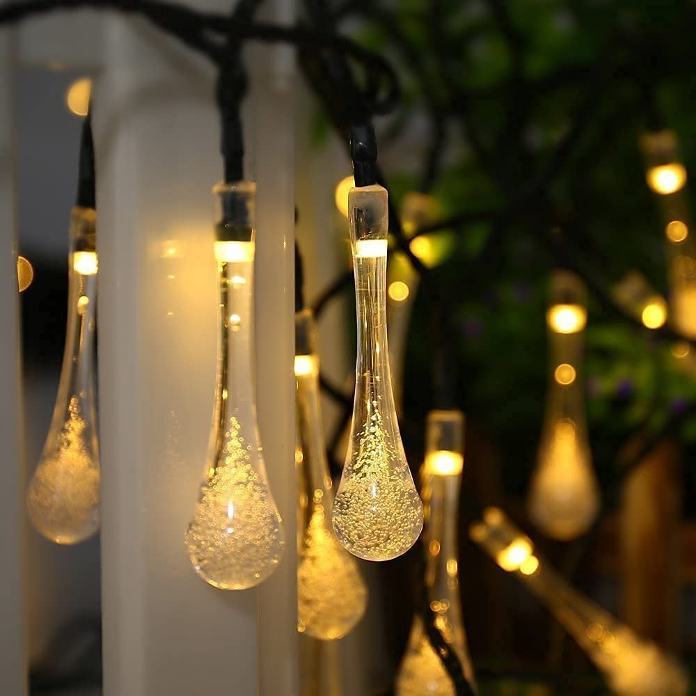 A row of glowing glass droplets shining brightly.