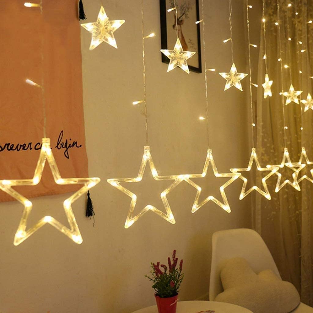  String of lights hanging from ceiling, creating a warm and cozy atmosphere.