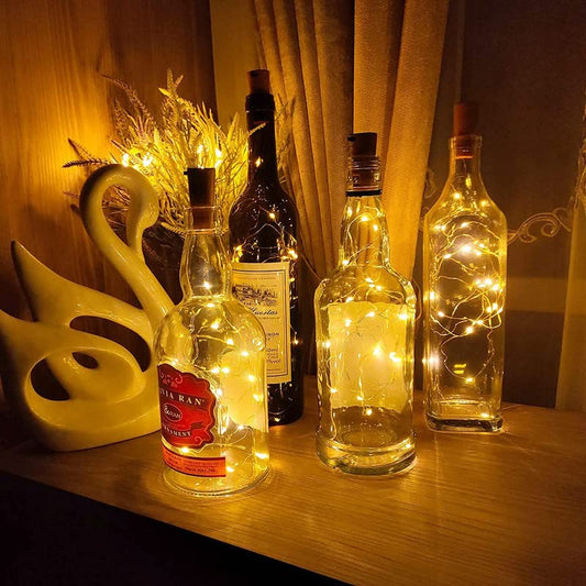 Vibrant wine bottles illuminated by LED lights, creating a fun and colorful display.