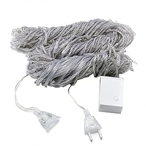 A white rope with two wires and a plug, plugged into a socket.