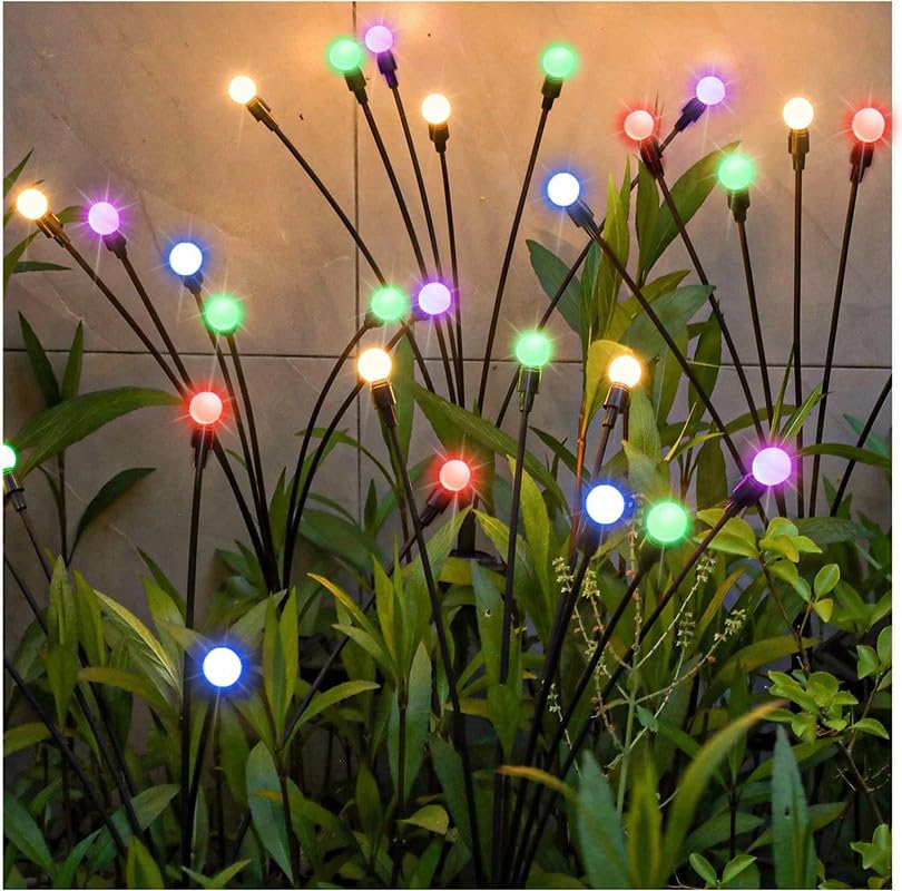  Solar powered garden lights with colorful lights illuminating a backyard at night.