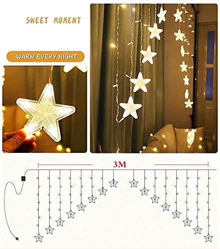  Holding up a star-shaped string light, casting a gentle and enchanting light in the room.