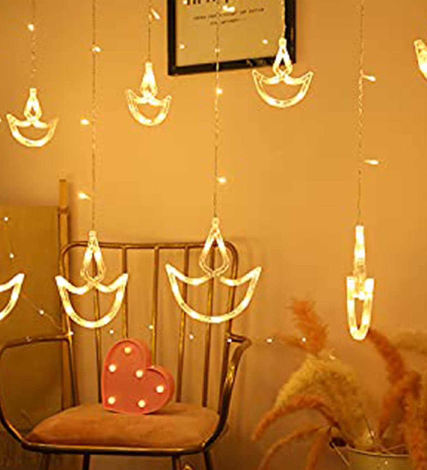  Interior of a pink room featuring a chair and a lamp.