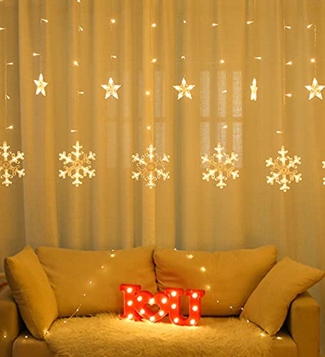 A room with a white wall adorned by a hanging snowflake. A serene and wintry ambiance fills the space.