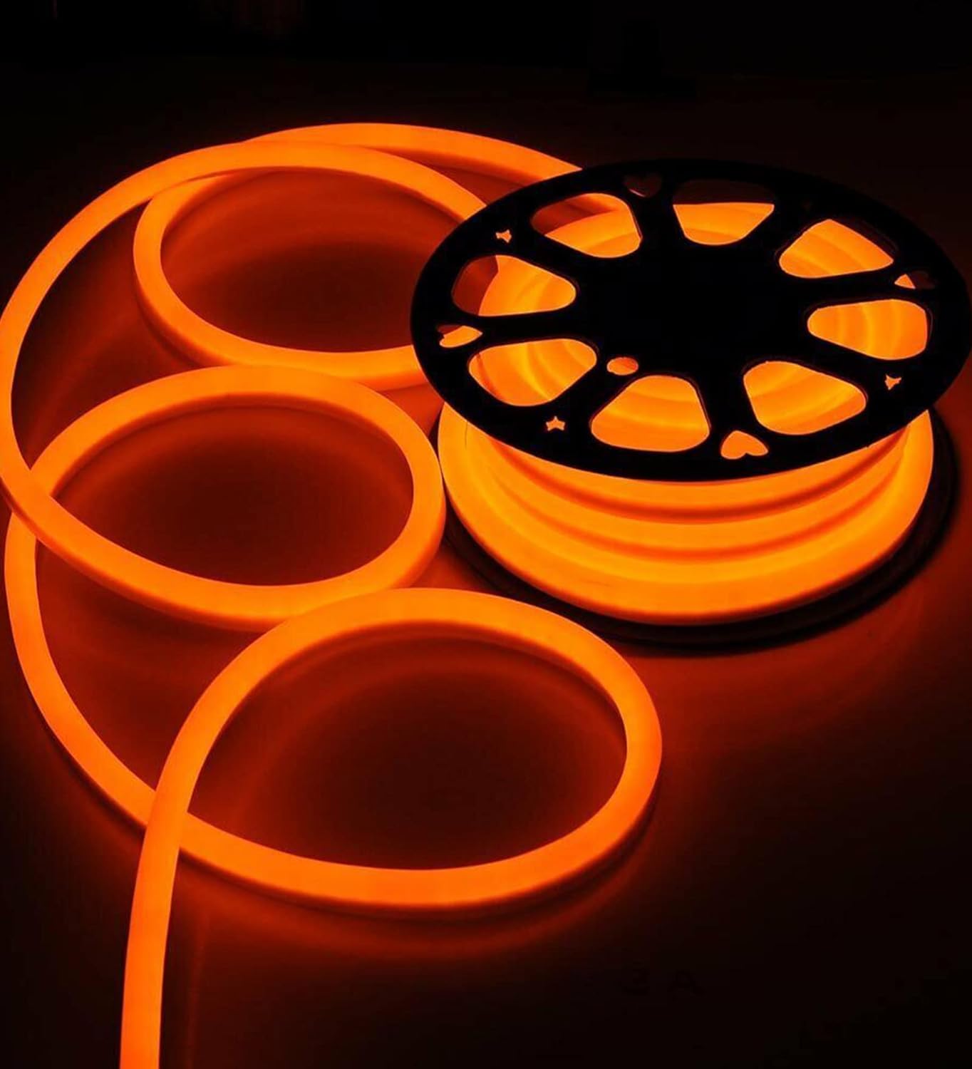 Bright orange neon light with film reel, perfect for movie lovers.