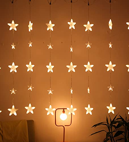  A room with a star curtain hanging overhead, illuminating the space with a celestial charm.