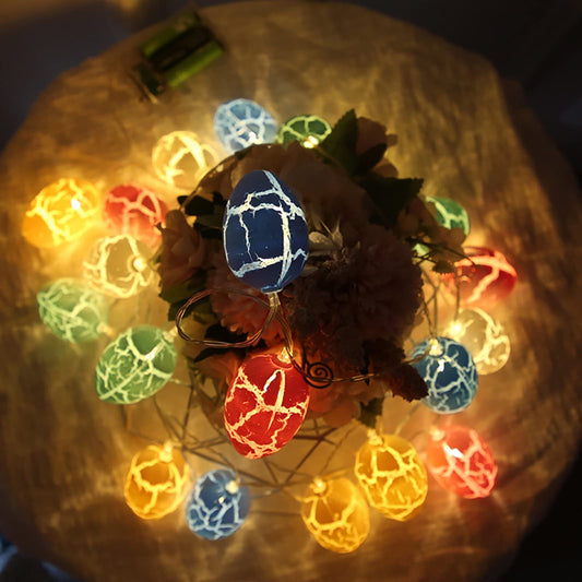 A flower arrangement with colorful lights on top