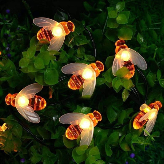 Group of bees with glowing lights.