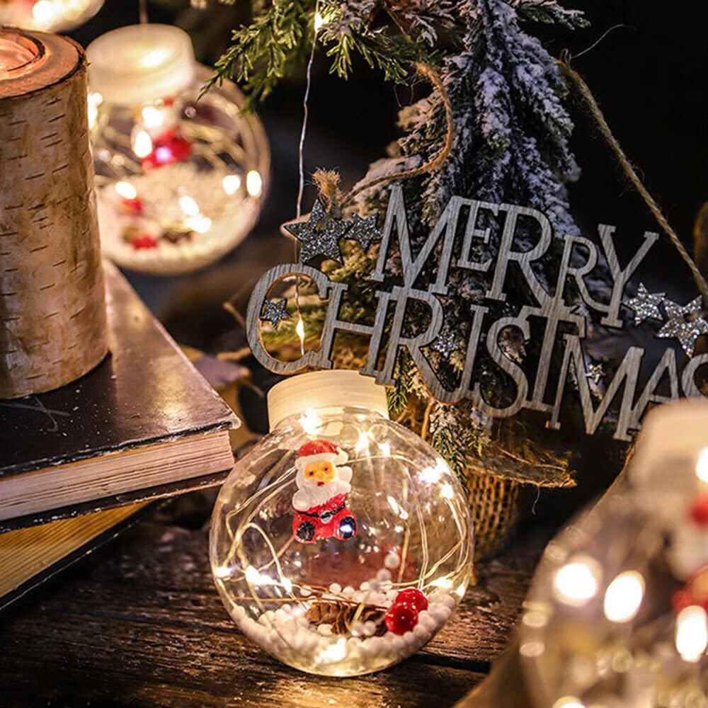 Ornate Christmas ball hangs from ceiling surrounded by lights.