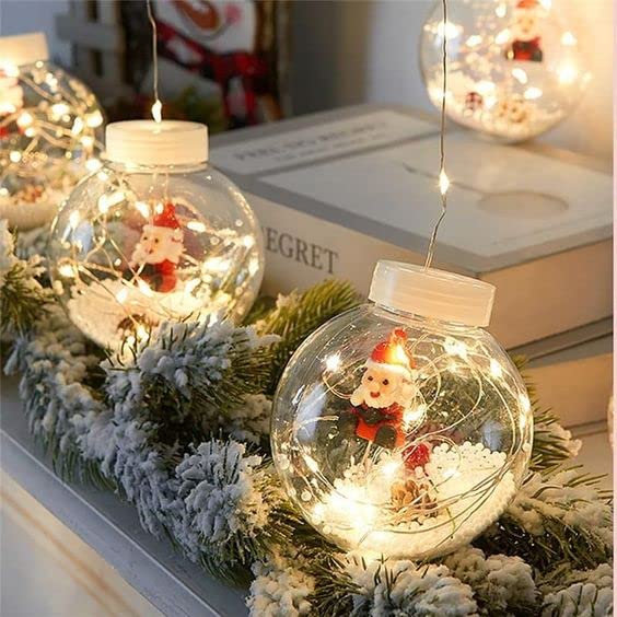 Holiday decoration dangles from ceiling amid sparkling lights.