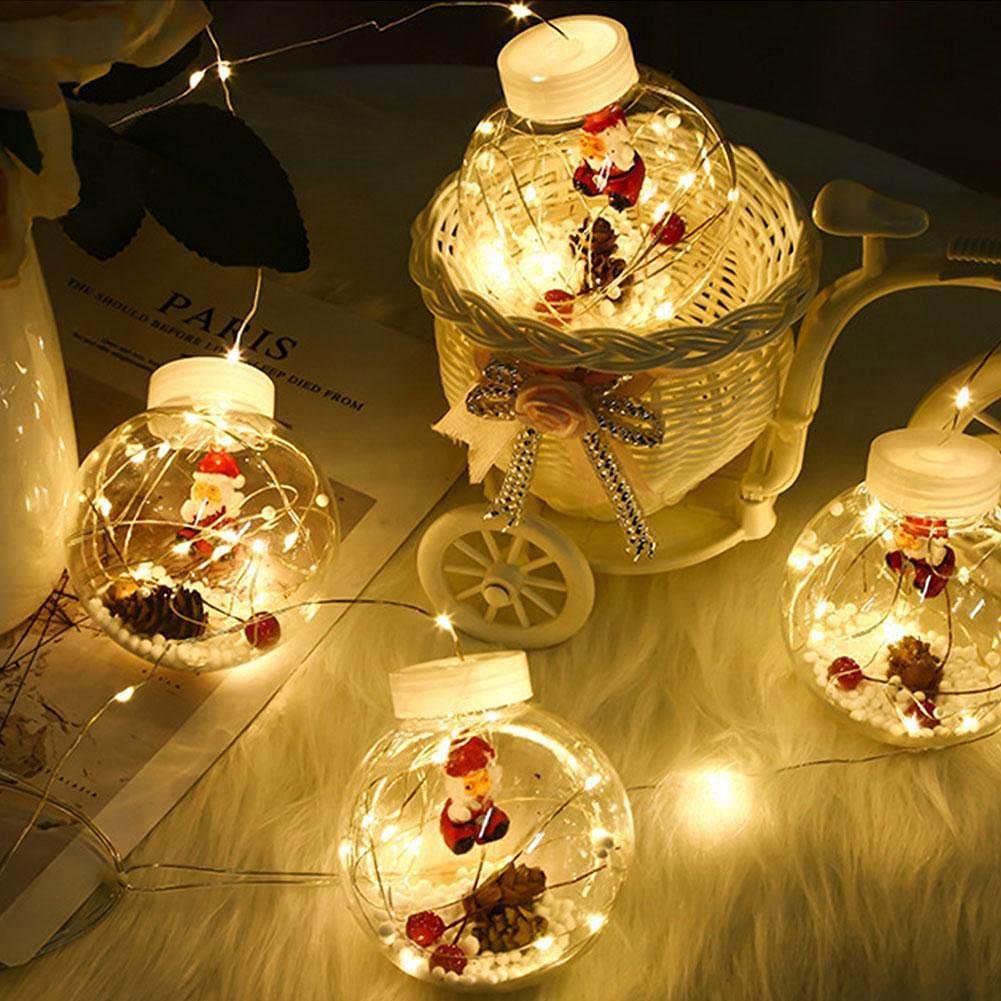 Elegant Christmas bauble suspended from ceiling with twinkling lights.