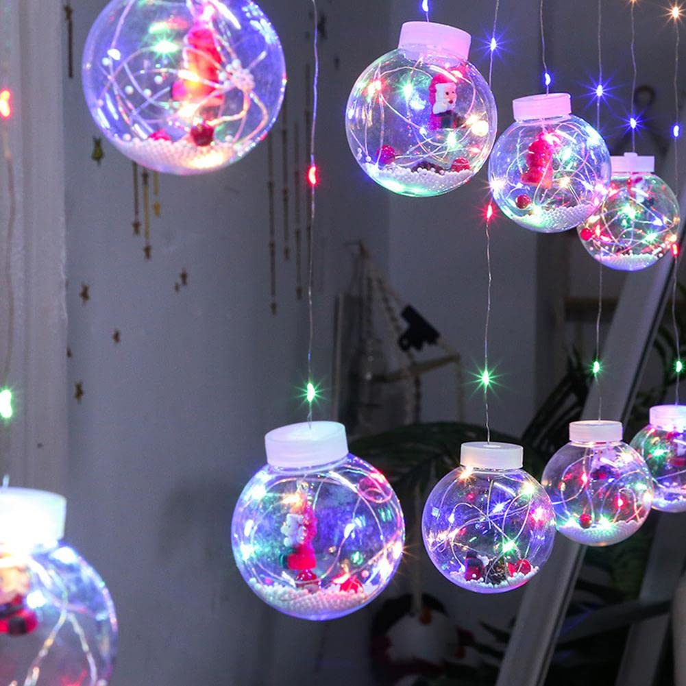  Christmas lights hanging from a ceiling, creating a festive and cozy atmosphere.